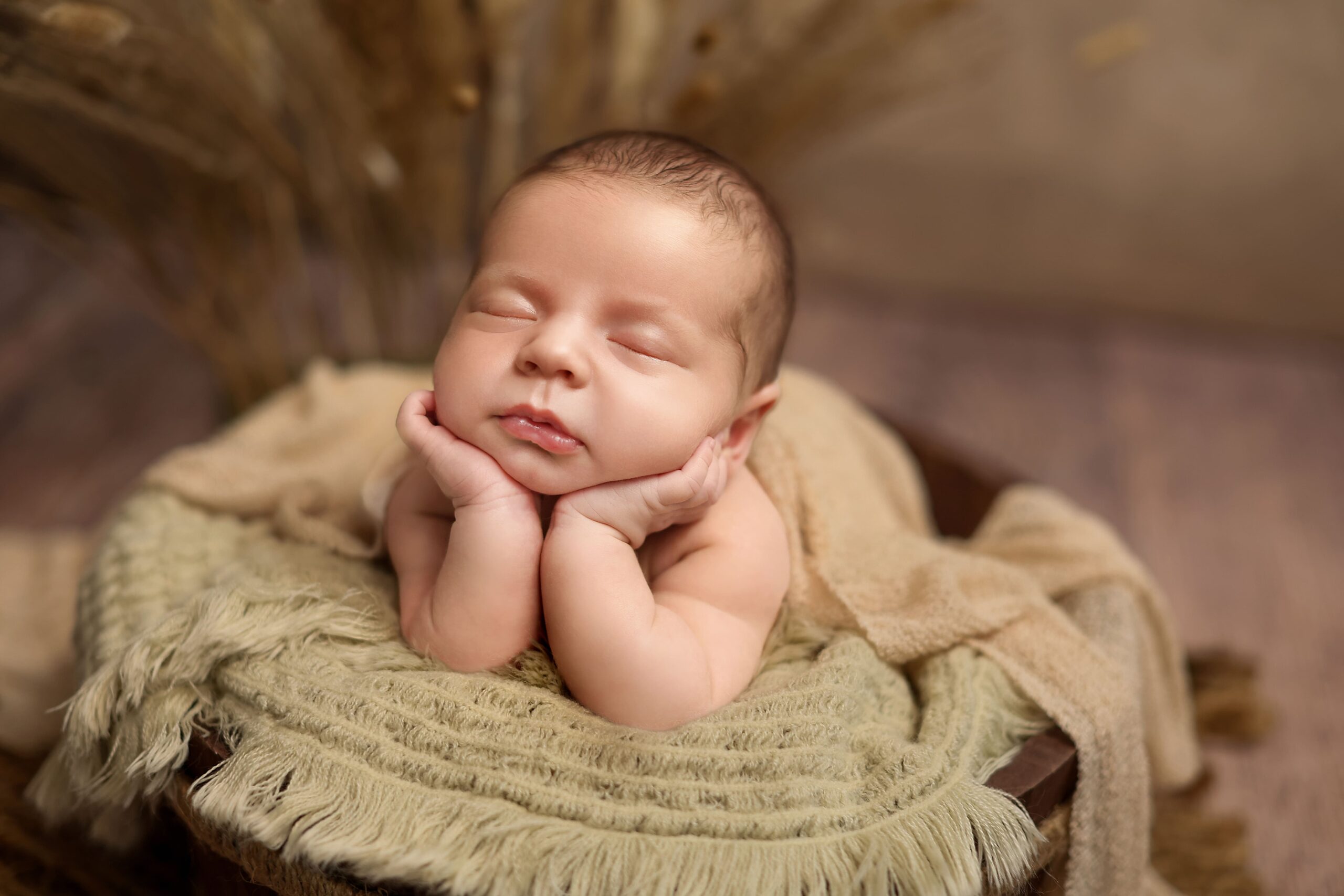 Fine art newborn portrait photographed in studio