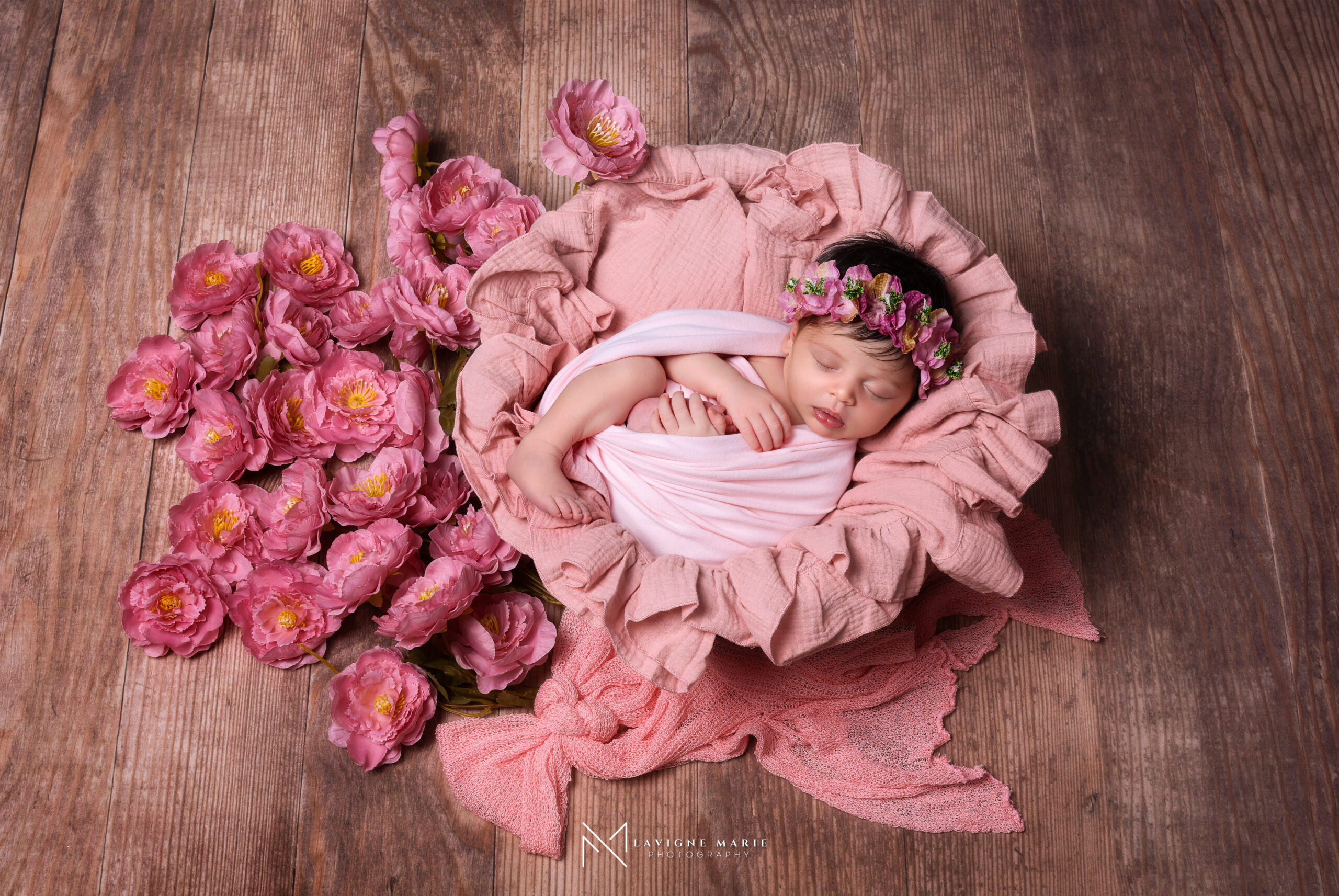 Newborn photography studio session for baby girl with soft lighting