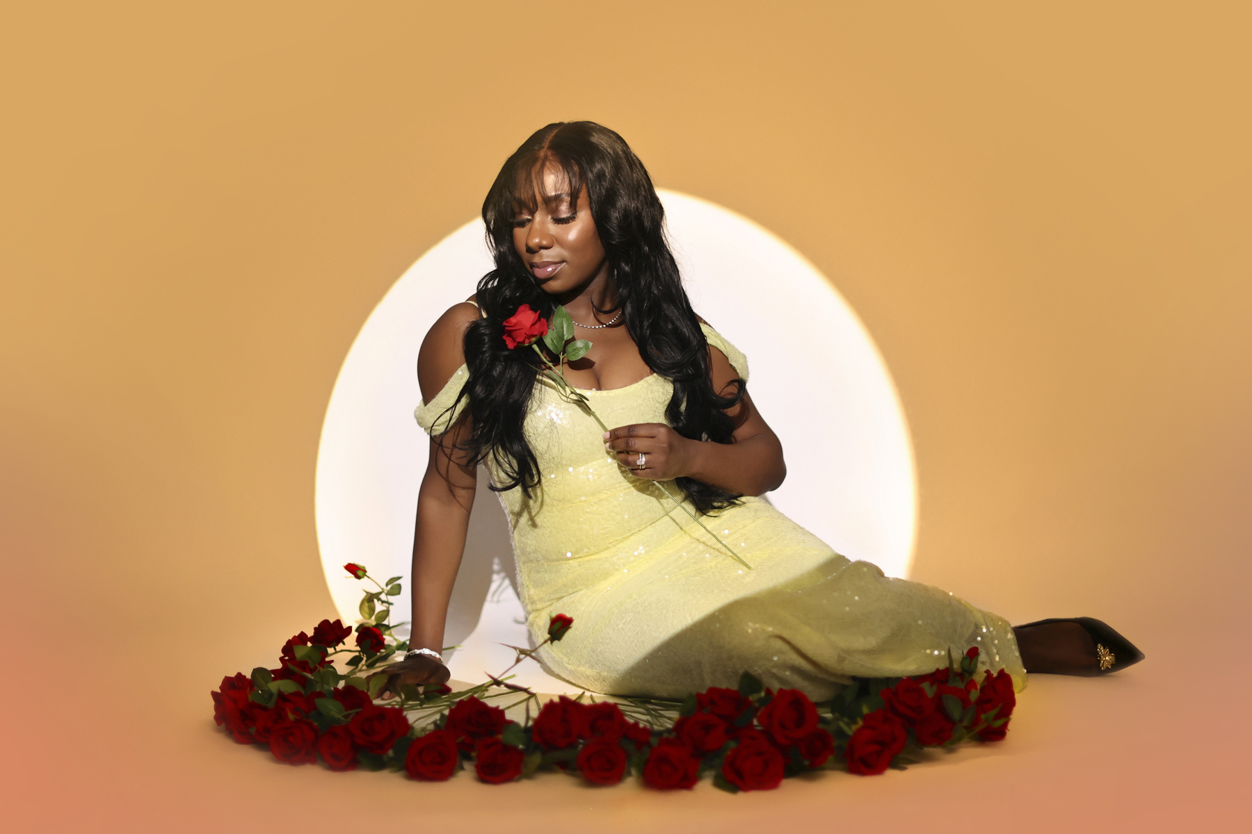 Child posing confidently during a studio birthday photoshoot with dramatic spotlight lighting.