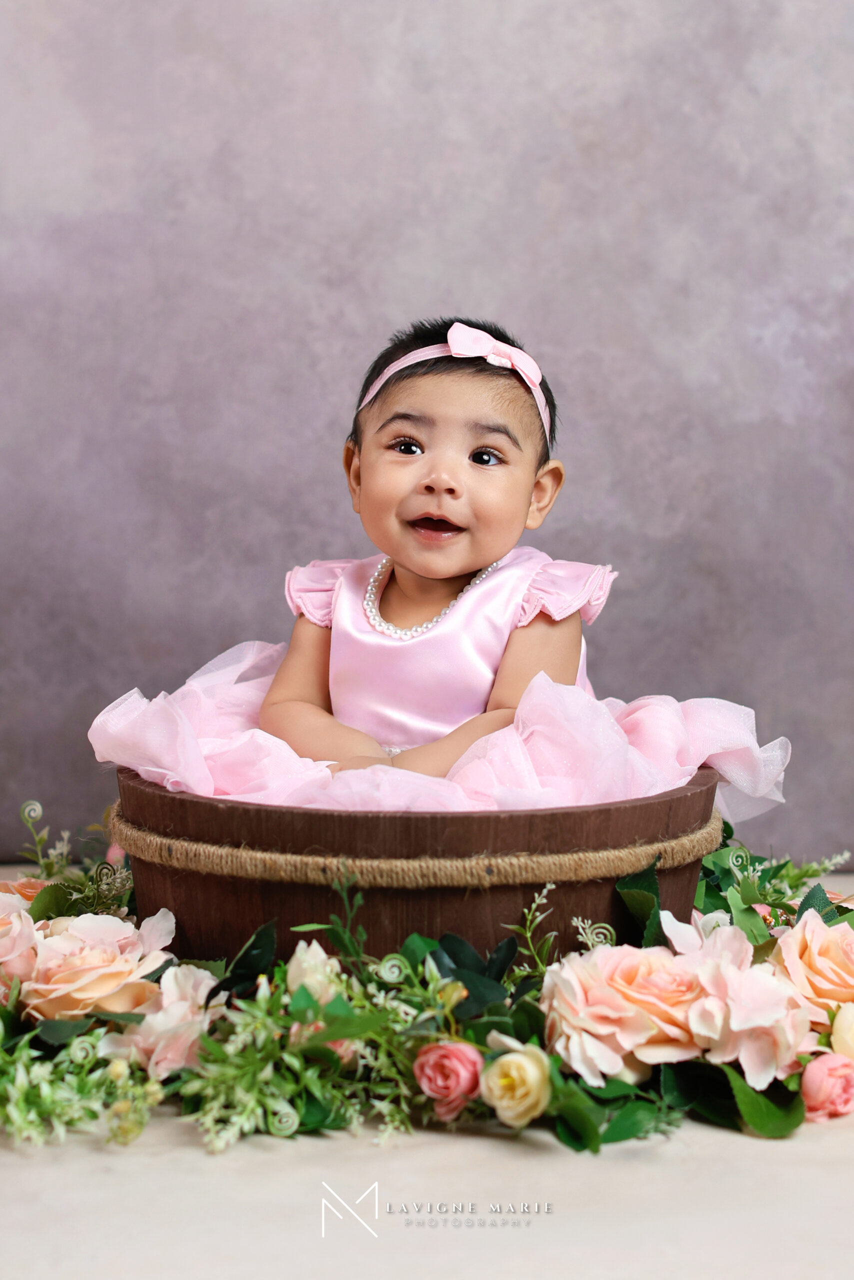 Professional toddler photoshoot in London studio featuring a natural, playful portrait of a young child in soft lighting.