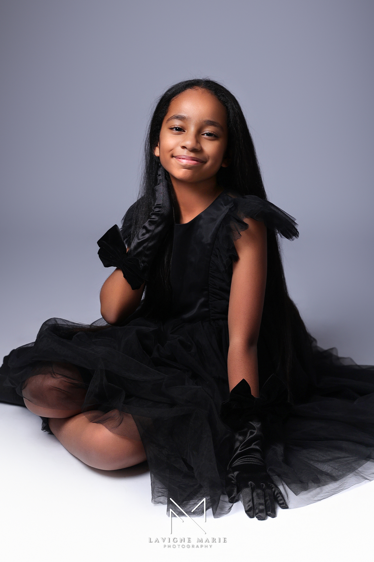 Professional children photo shoot for a model portfolio with natural posing and studio backdrop