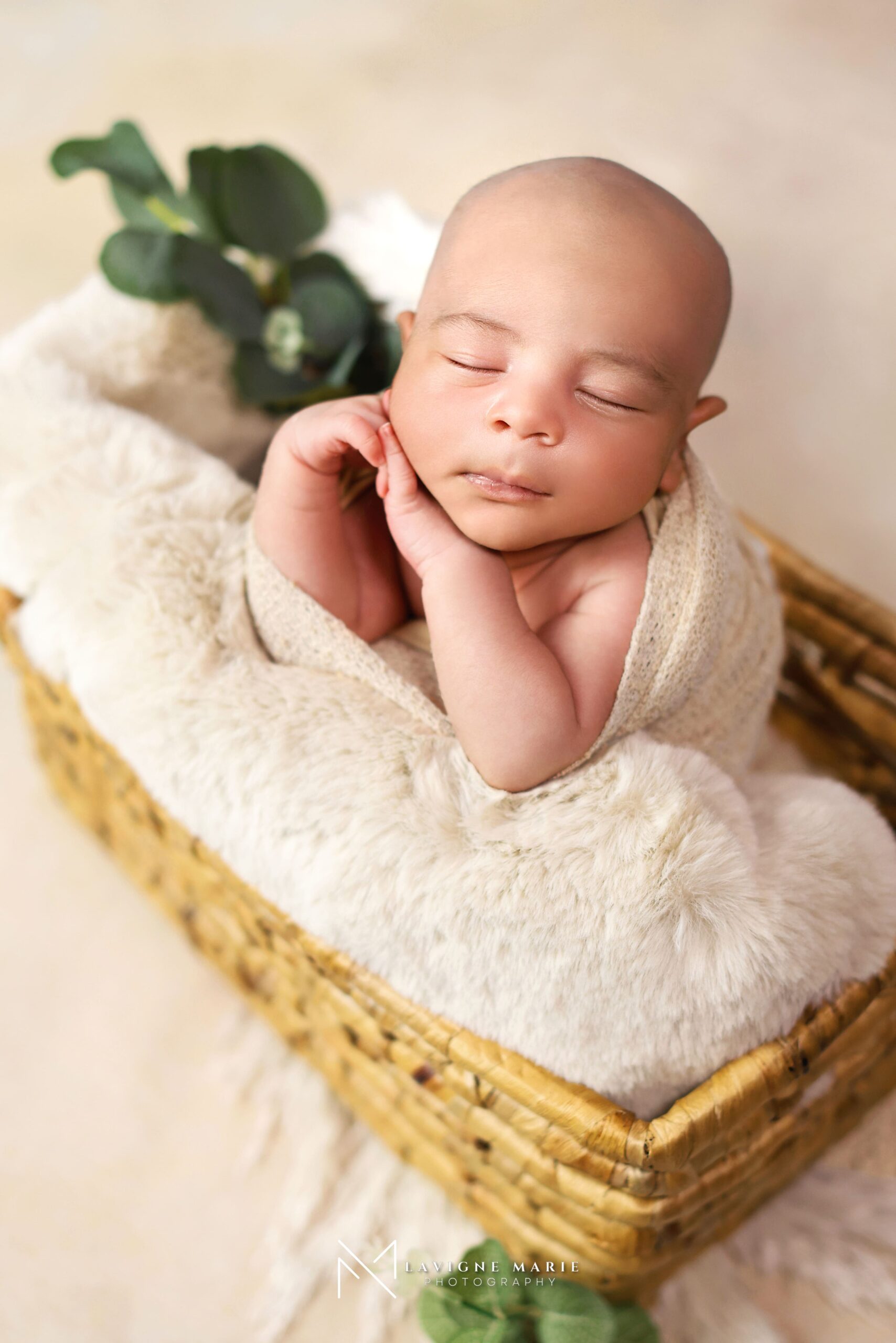 Newborn baby studio photoshoot in London with light cream backdrop and soft natural tones