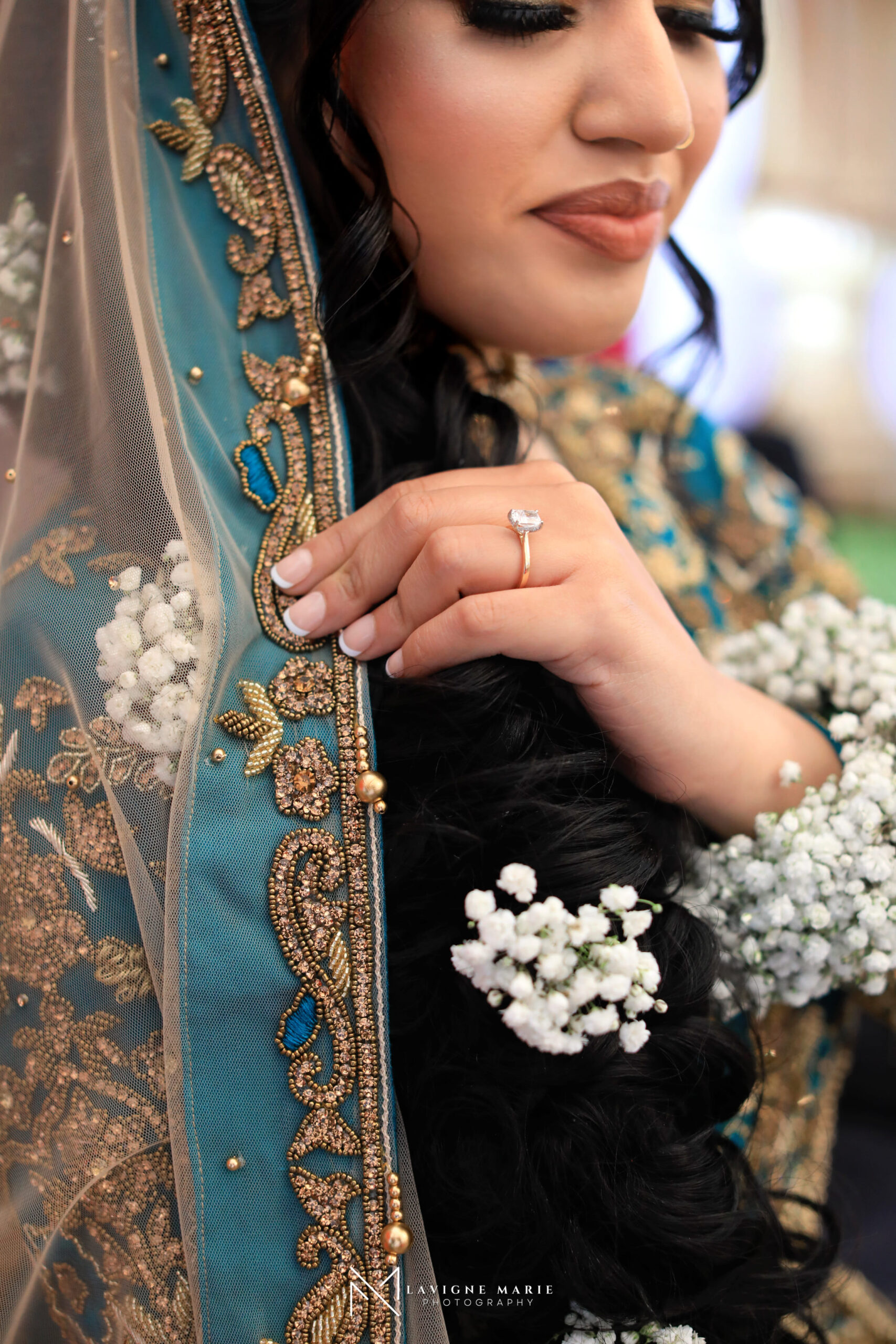 Female photographer covering Mehndi ceremony at Asian wedding in London