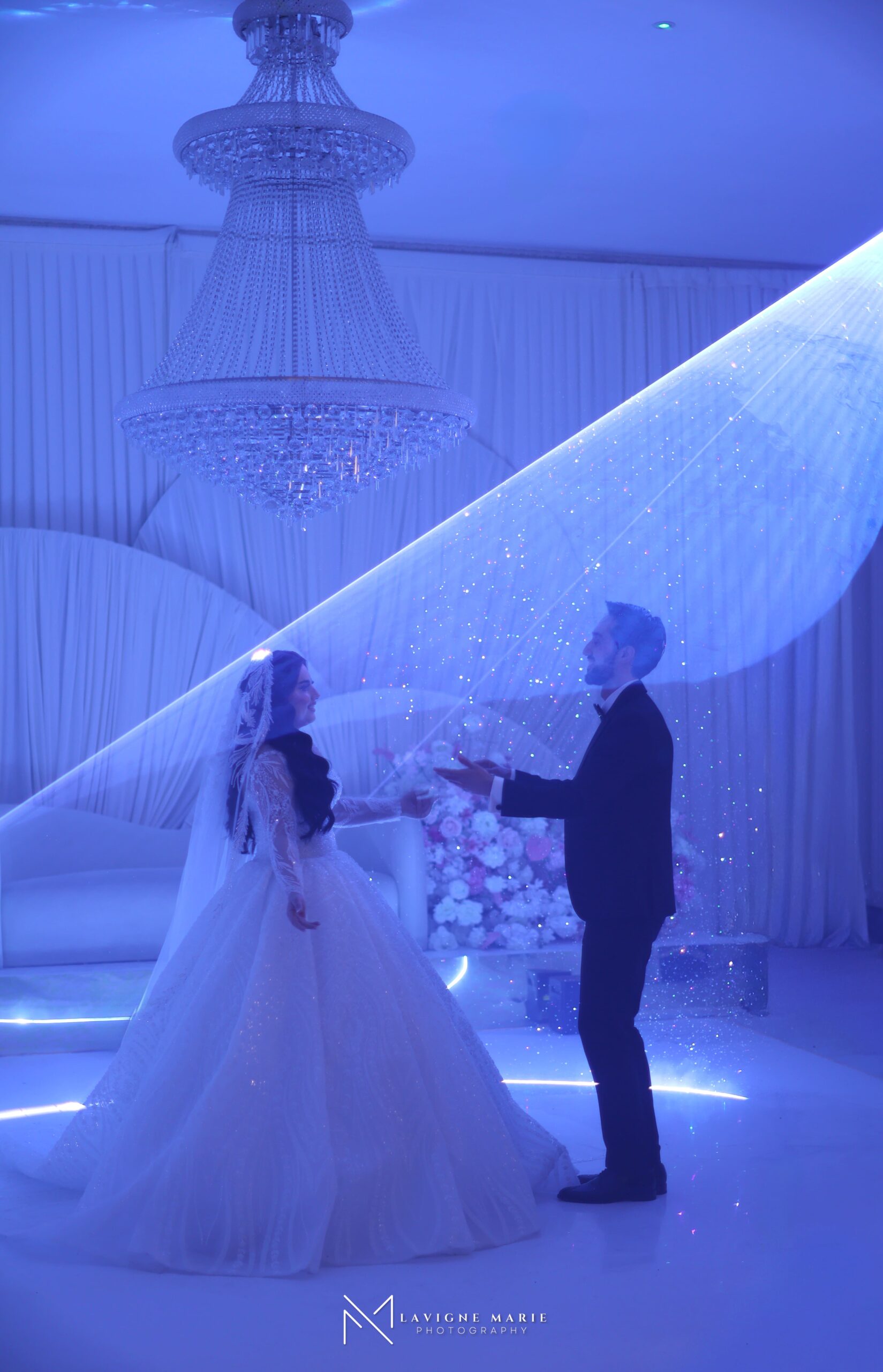 Female wedding photographer in East London taking a portrait of the couple