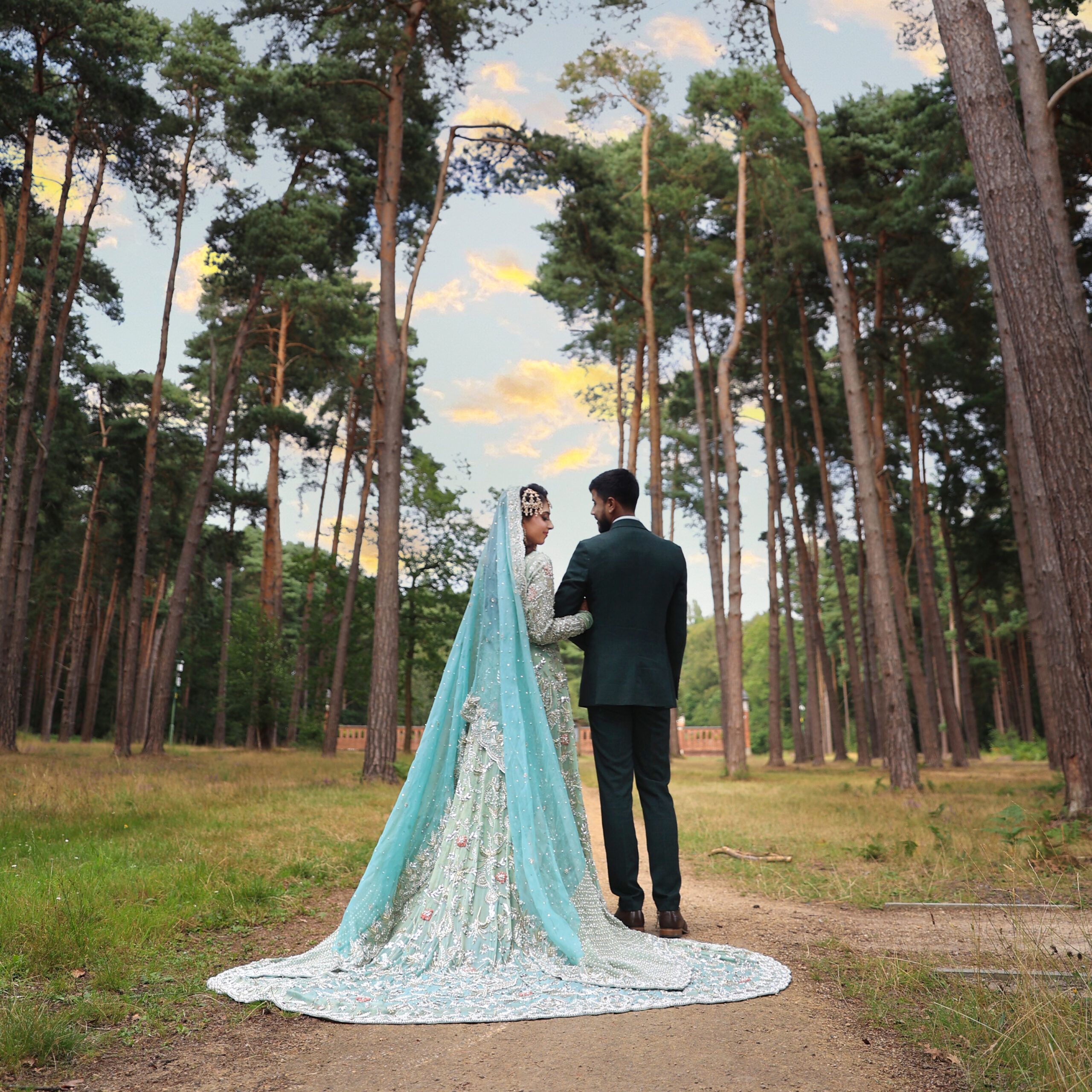 Bride in wedding dress during creative trash the dress photoshoot captured by female photographer in London with dramatic outdoor setting