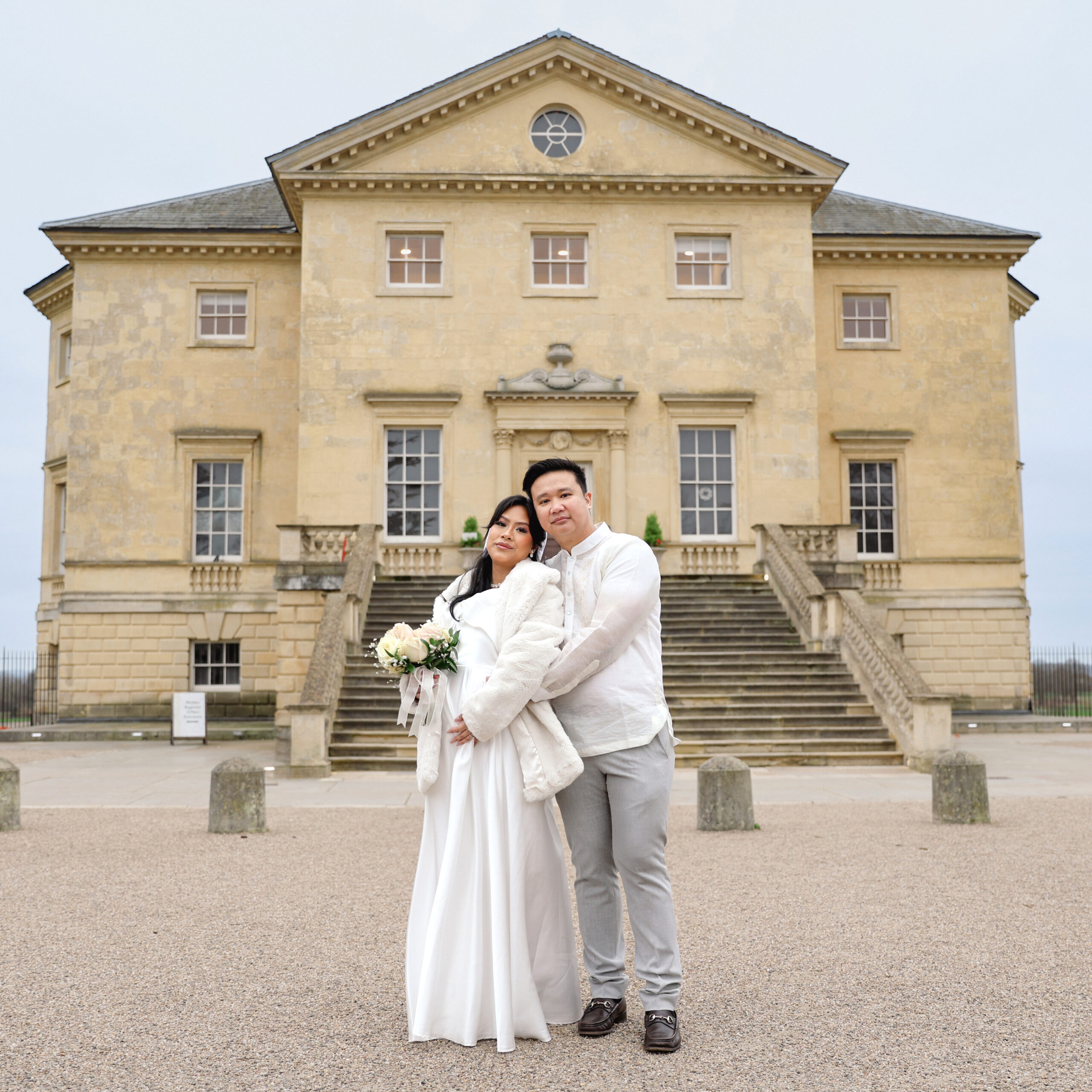 Wedding registry moment captured by female photographer at Danson House featuring couple signing marriage documents in elegant historic venue
