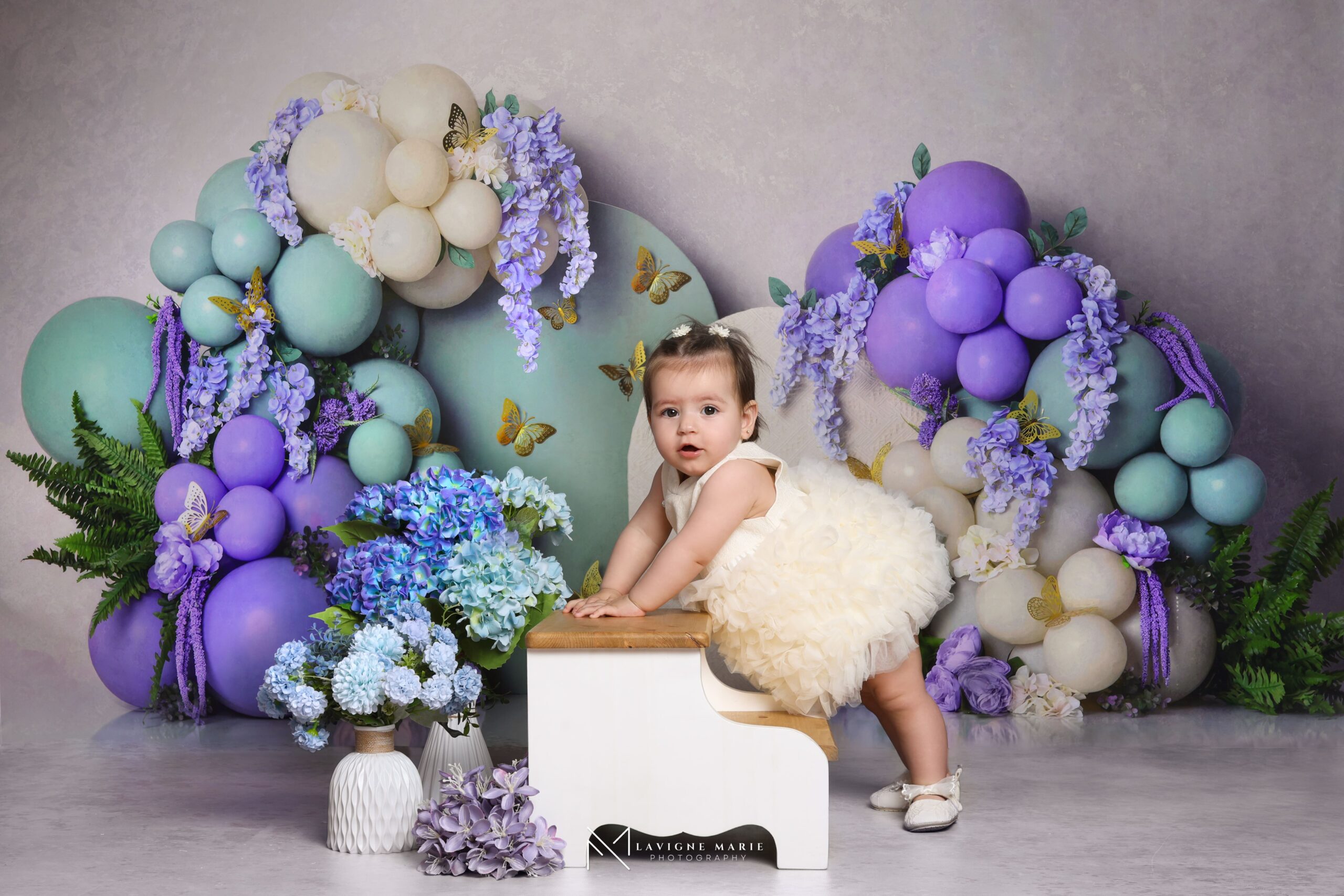 First birthday photoshoot with a female photographer in London, capturing natural portraits and cake smash memories.