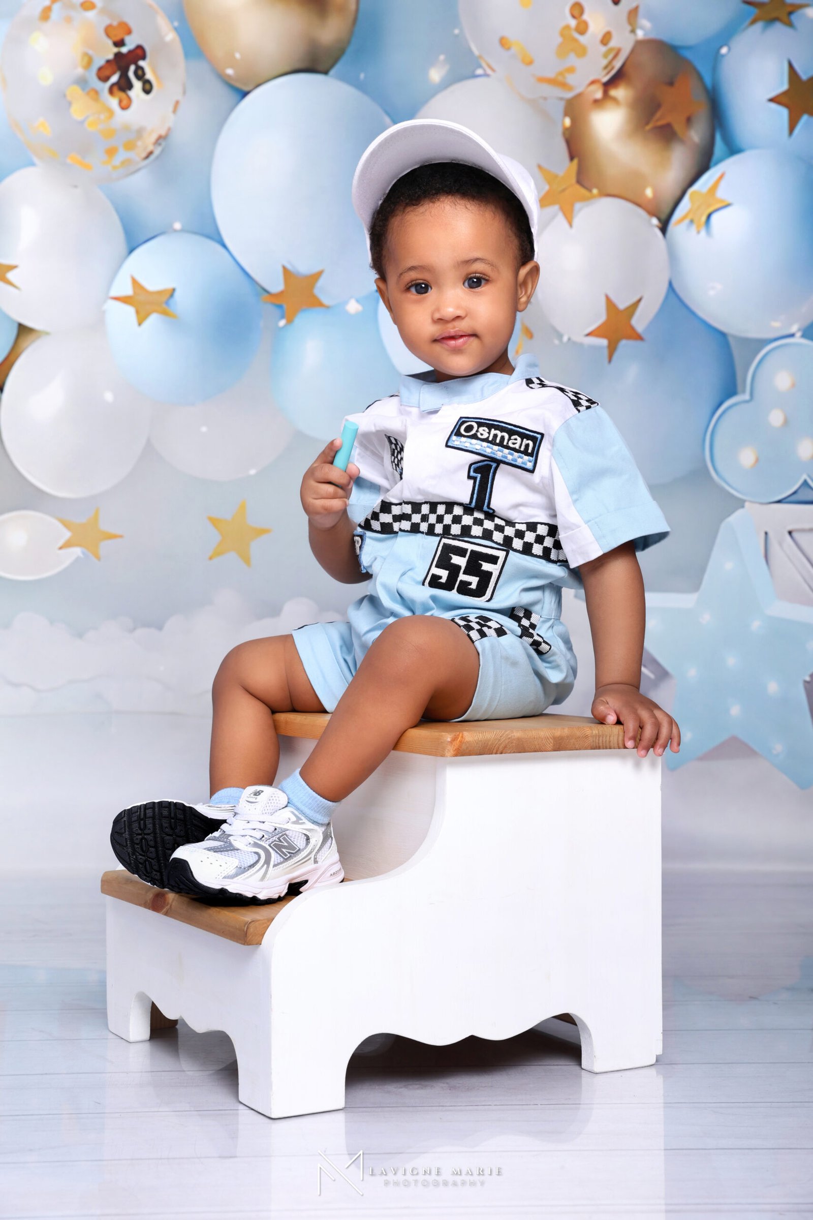 Baby boy celebrating his first birthday during a styled studio photoshoot