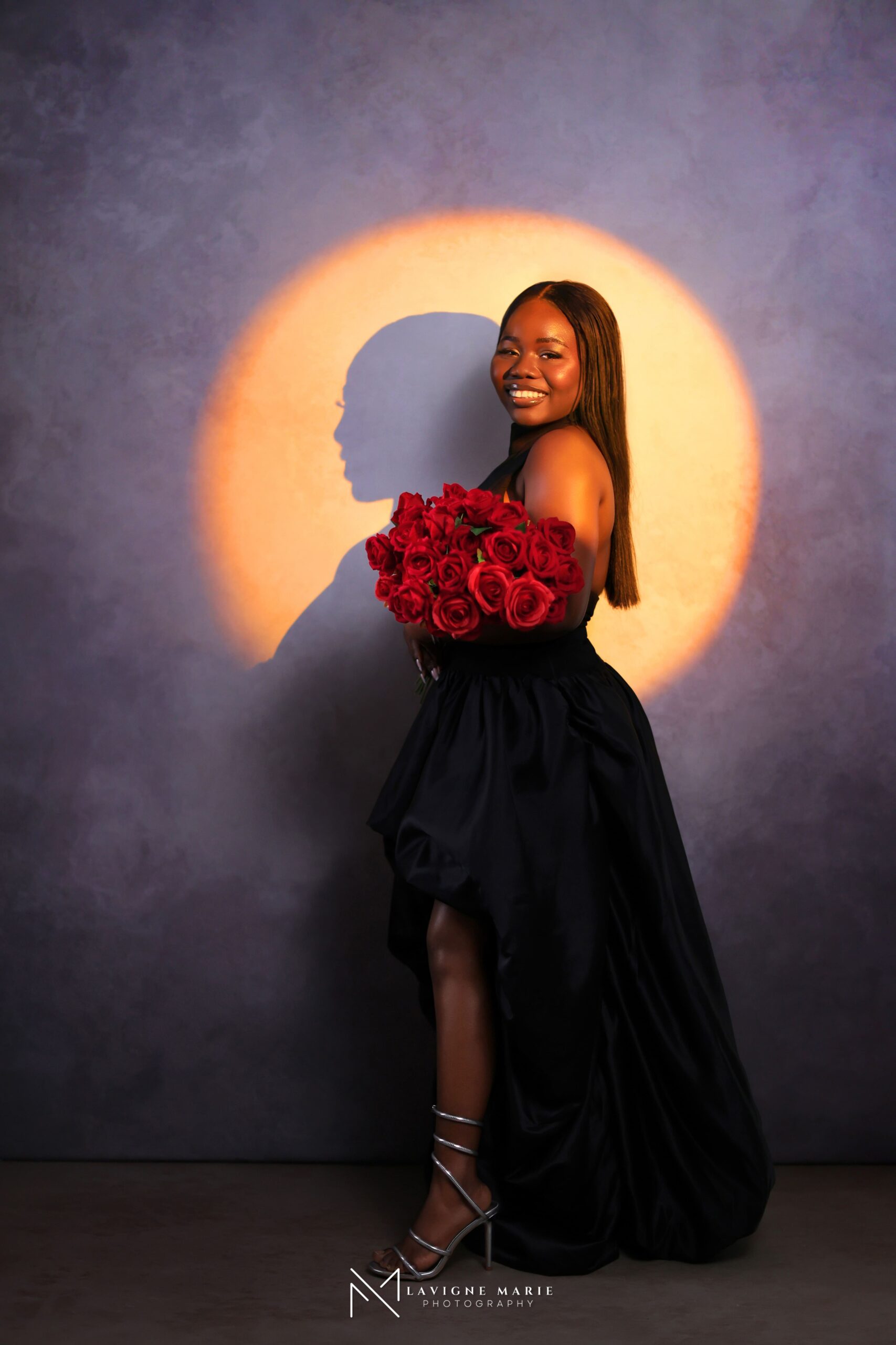 Spotlight birthday photoshoot by Lavigne Marie Photography showing a glamorous studio portrait with soft dramatic lighting.