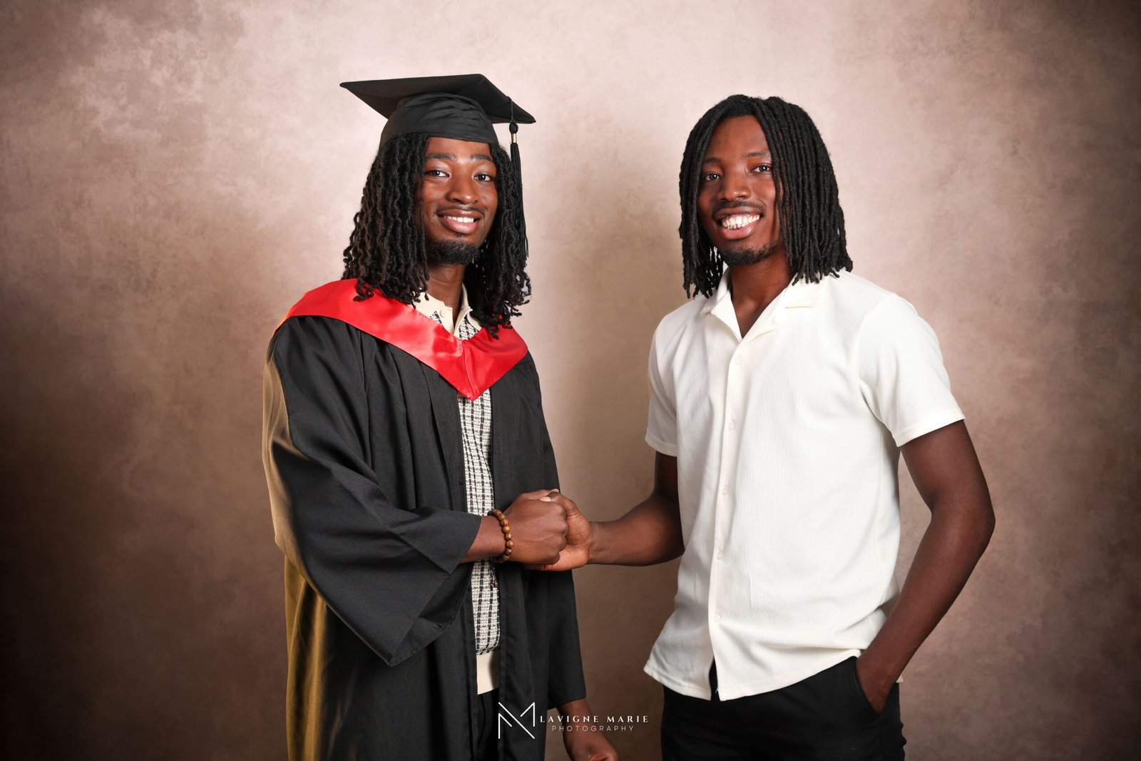 Family graduation studio photoshoot with university graduate in London