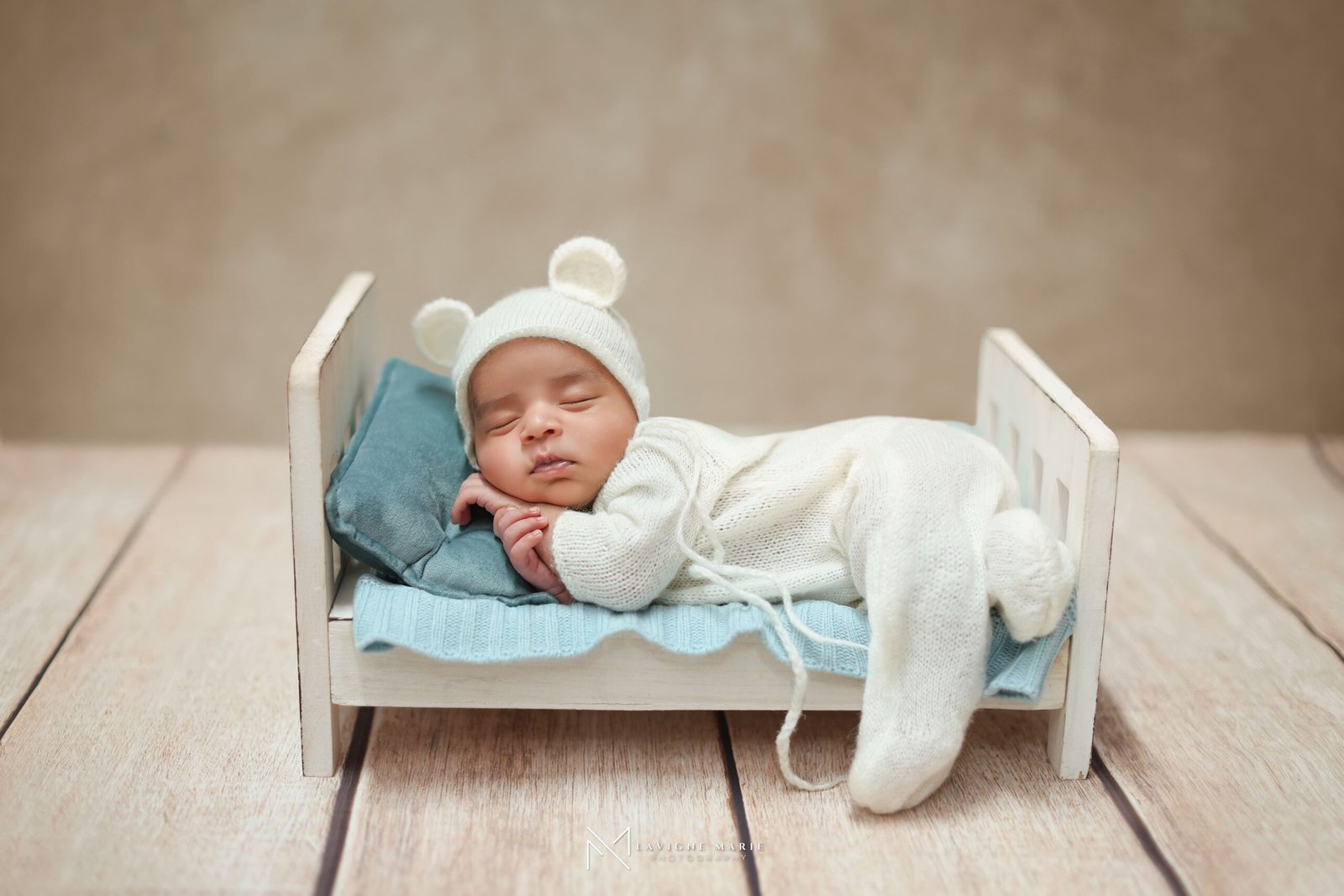 Newborn studio photoshoot in London with baby professionally posed for portraits