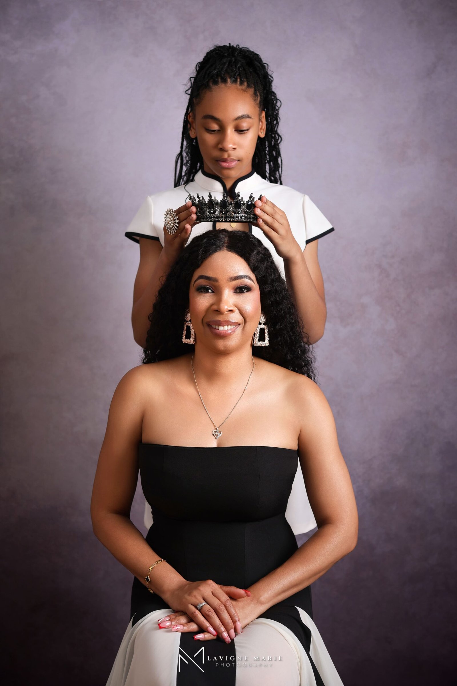 Mother and daughter sharing a loving family moment during a professional studio photoshoot in London by Lavigne Marie Photography