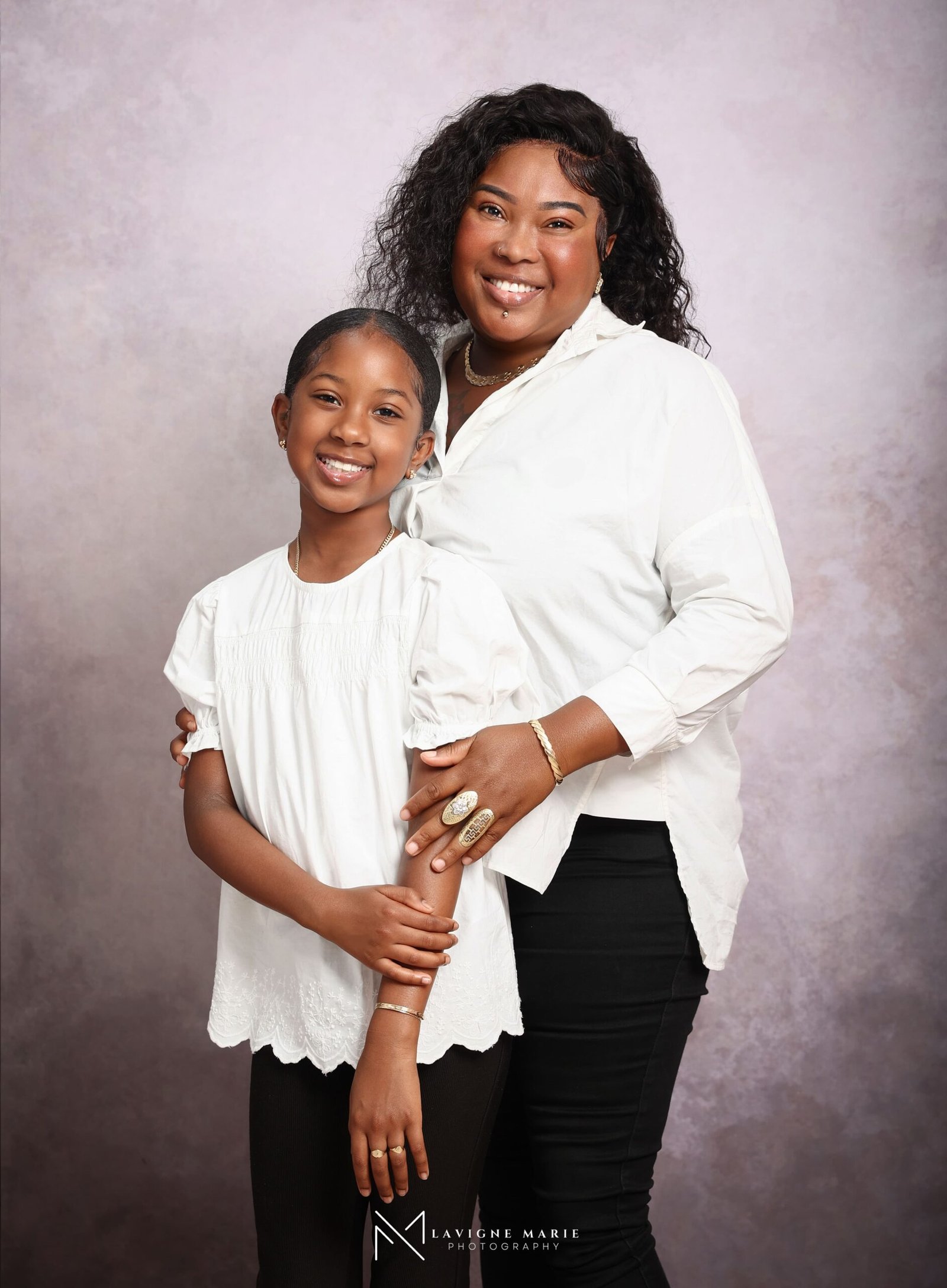 Family sharing a loving moment during a professional studio family photoshoot in London